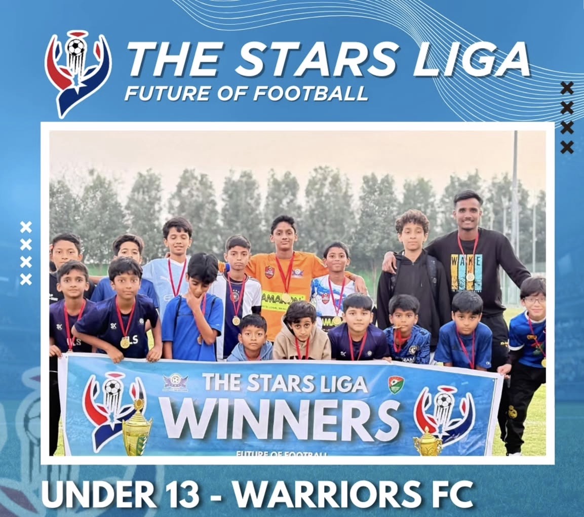 Under 13 winners Warriors FC holding The Stars Liga Winners banner